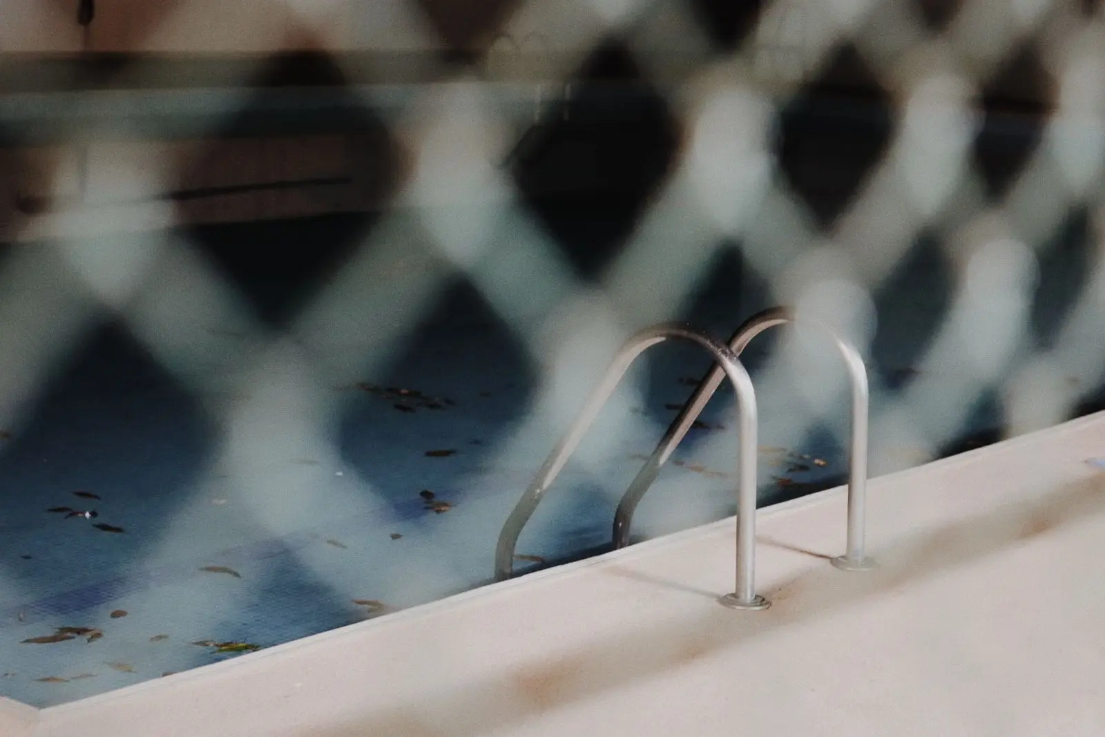 Mesh between a work area and a pool deck