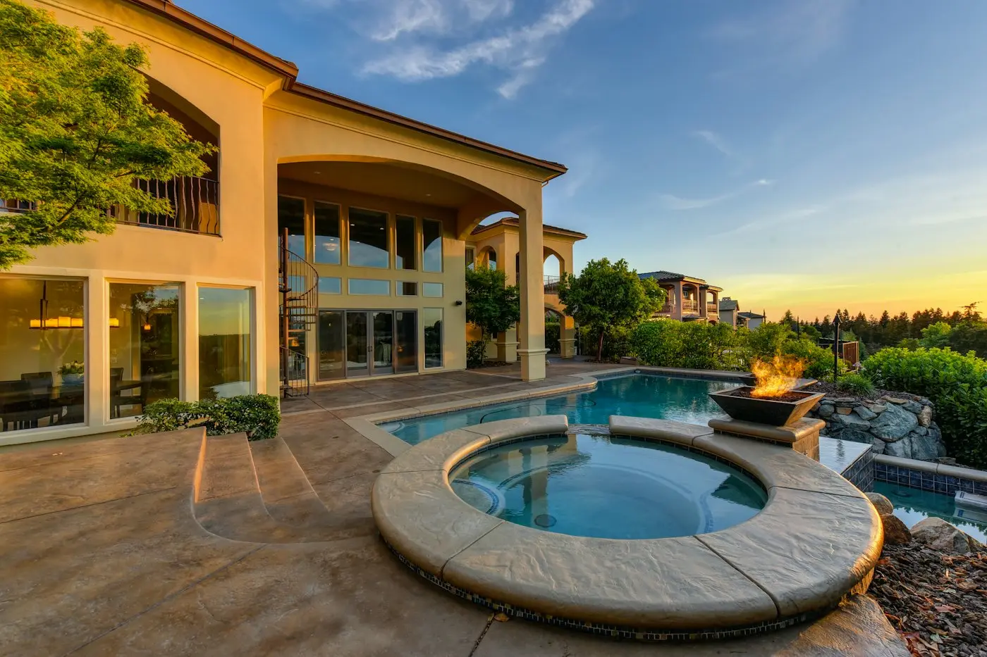 Residential swimming pool and patio beside a house